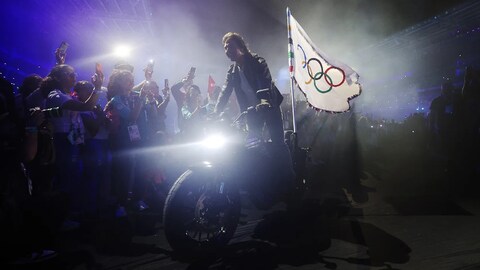 There’s Something Different About That Moto Tom Cruise Rode Out of the Closing Ceremony