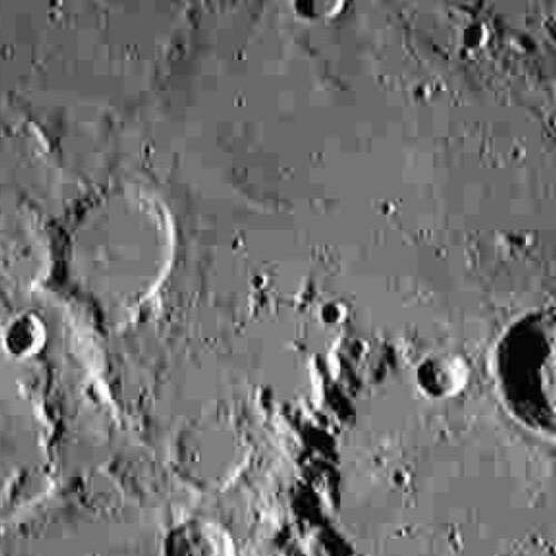 Pioneering spacecraft reaches moon's orbit, beams back images