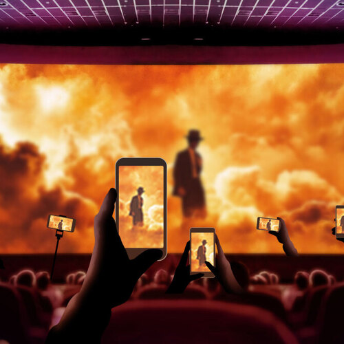 Why is everyone using their phones in movie theaters?