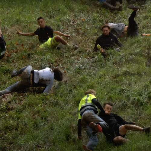 Watch legendarily brutal British cheese roll event in painful slow motion